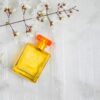 Perfume bottles and flowers on a beautiful white background