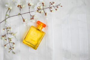 Perfume bottles and flowers on a beautiful white background